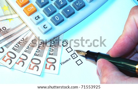 Checkbox with pen in hand and money isolated on white
