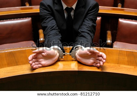 businessman in the judicial process with handcuffs