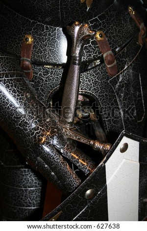 Medieval Knight in Armor with Sword and Shield Closeup