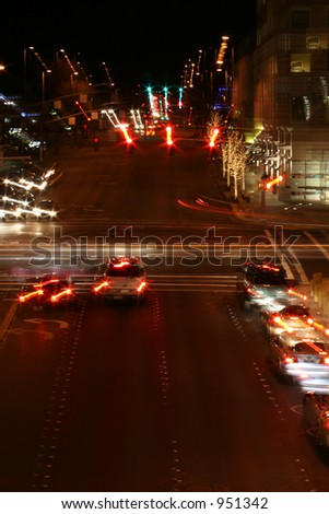 Blur of Automobiles Idling at Urban Downtown Traffic Light Bellevue Washington