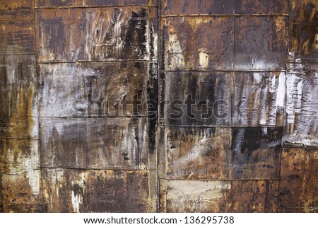 Rusty metal door of different colors, and property protection