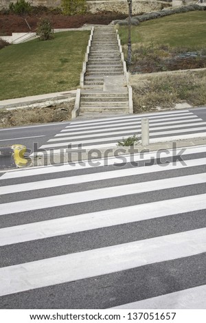 Zebra crossing road with stairs and the bottom field, Traffic