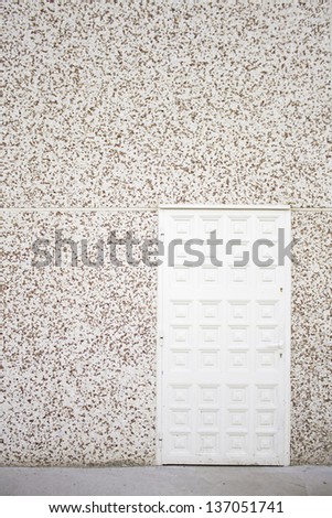 Wooden door with white granite wall with space for text, construction