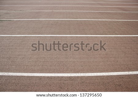 Athletic track with  symbols painted on the floor, sport and fun
