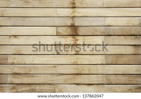 Dark and light wood planks on the door of a building, construction and decoration