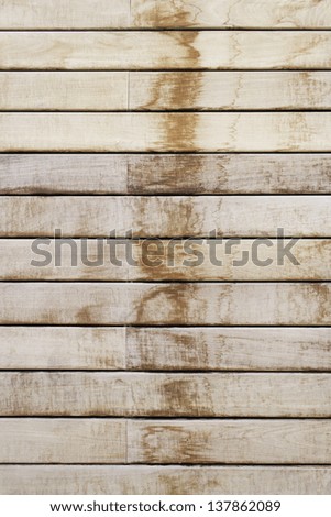 Dark and light wood planks on the door of a building, construction and decoration