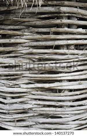 Wicker nest of sticks and straw roof, construction and animals