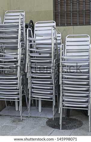 Chairs metal outdoor bar urban street, businesses