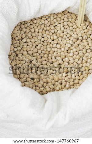 Raw chickpeas in market feed bag, food