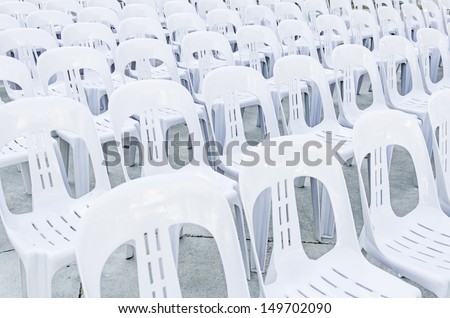 White plastic chairs in celebration and outdoor event
