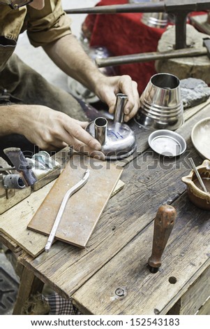 Tinplate worker object making crafts market, professional