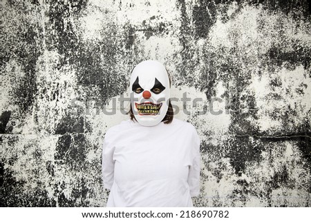 Crazy clown mask halloween costume and fear