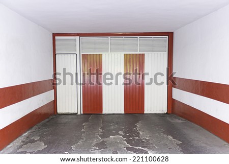 Red and white door in garage townhouse, construction