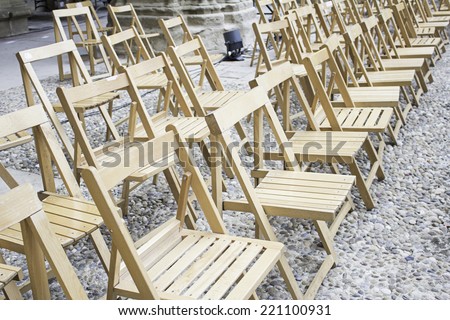 Wooden chairs in street event, celebration