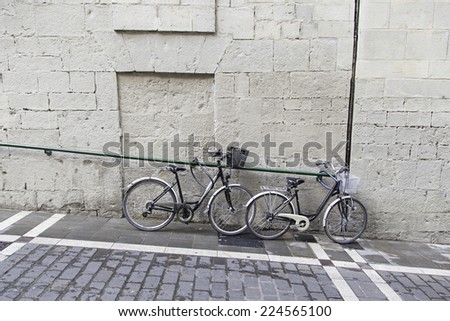 Bicycles parked in urban street, vehicle and transportation
