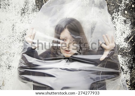 Woman trapped corpse bag, fear and violence