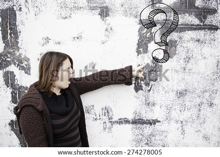 Woman points interrogation urban wall symbol