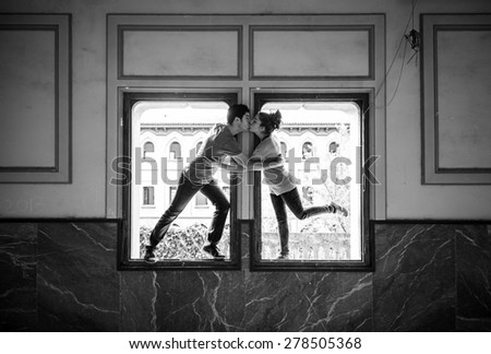 Window couple kissing, romantic and love