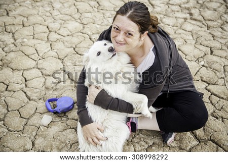 Woman with dog walking in the forest, animals