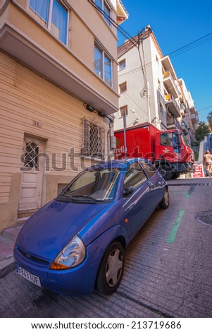 BARCELONA, SPAIN - FEB 7, 2014: Baixada de la Gloria street leading to famous Park Guell entrance on Feb 7, 2014 in Barcelona Spain. It\'s one of most steep rise in this city titled as The glory slope