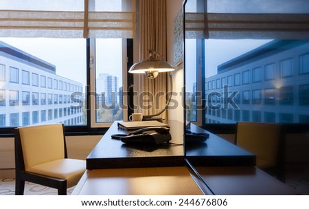Study room with writing desk armchair and lcd tv set