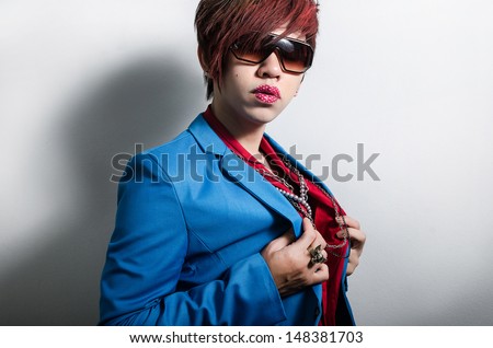 Fashionable man with posing with lipstick tattoo
