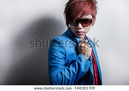 Fashionable man with posing with lipstick tattoo
