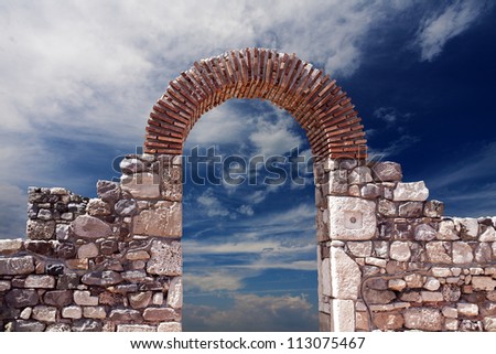 Stone arch against the sky