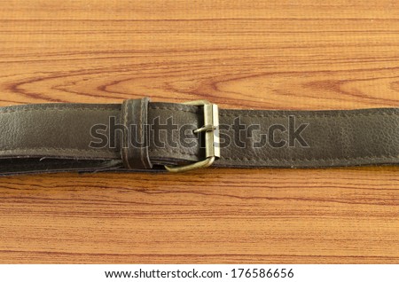 bag leather strap on wood background
