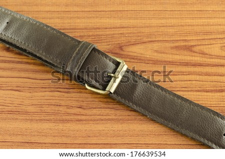 bag leather strap on wood background