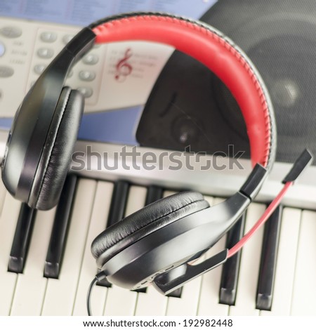 headphones on electric  music instrument piano keyboard