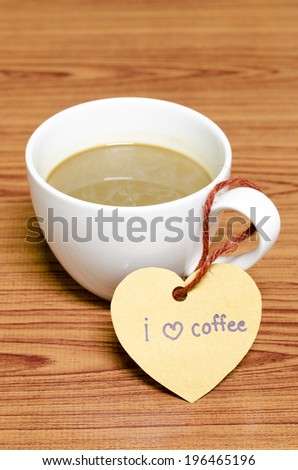 coffee cup with heart tag write I love coffee word on wood background
