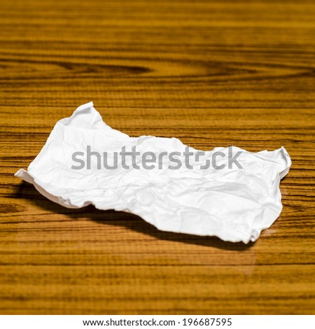 paper scrap on wood background