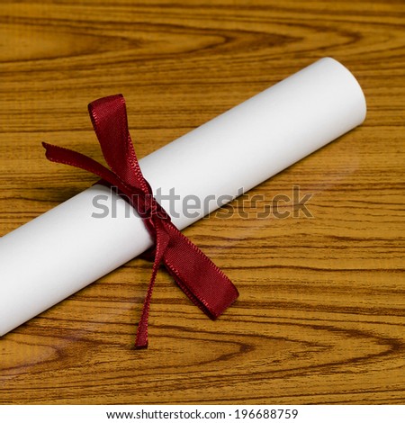 diploma on wood background