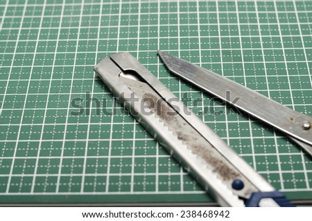 tools on green cutting mat