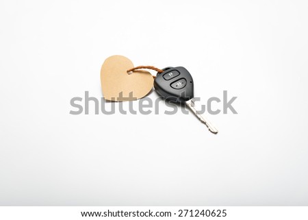 car key and heart tag isolated on white background