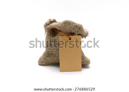 Empty burlap sack with tag isolated on white background