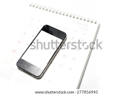 smart phone on calendar isolated on white background