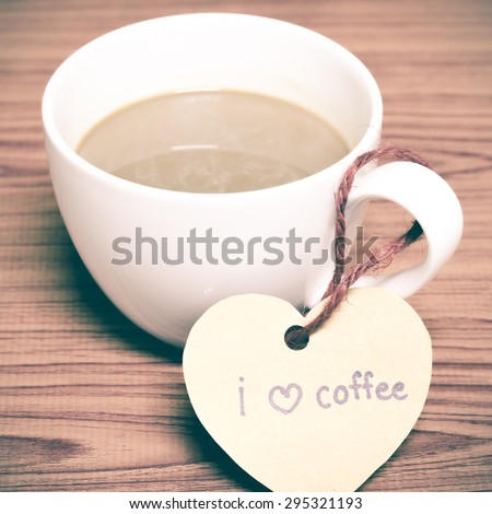 coffee cup with heart tag write I love coffee word on wood background vintage style