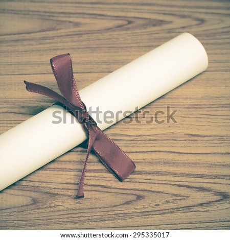 diploma on wood background vintage style