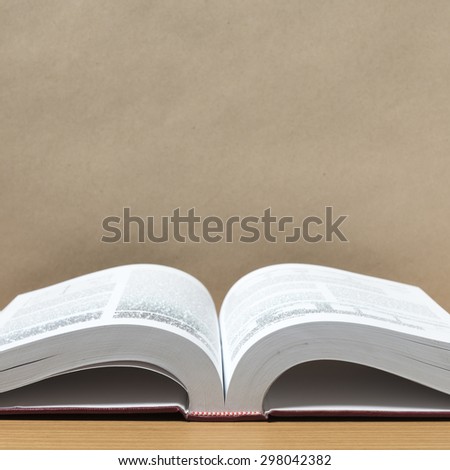 open book on wood background