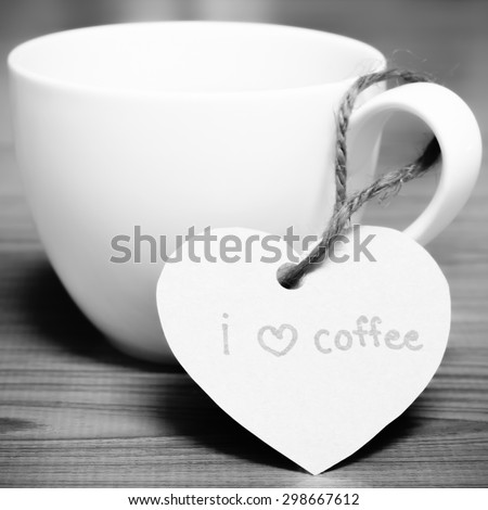 coffee cup with heart tag write I love coffee word on wood background black and white color tone style