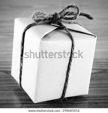 gift box on wooden background black and white color tone style
