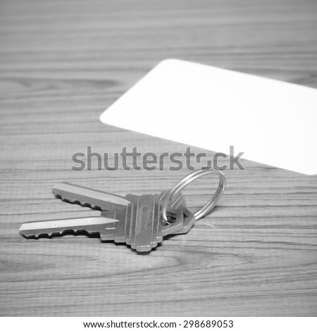 business card and keys on wood background black and white color tone style