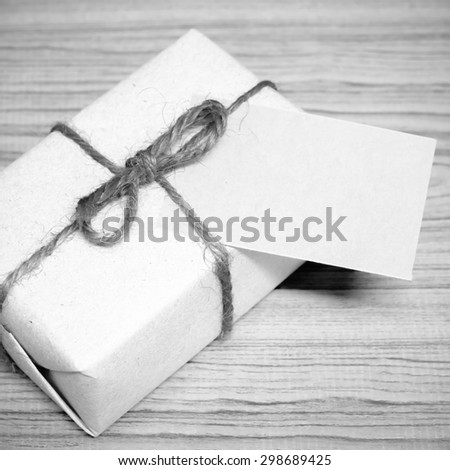 gift box and card on wood background black and white color tone style