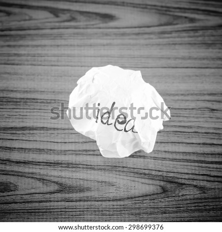 writing idea word on crumpled on wood background black and white color tone style