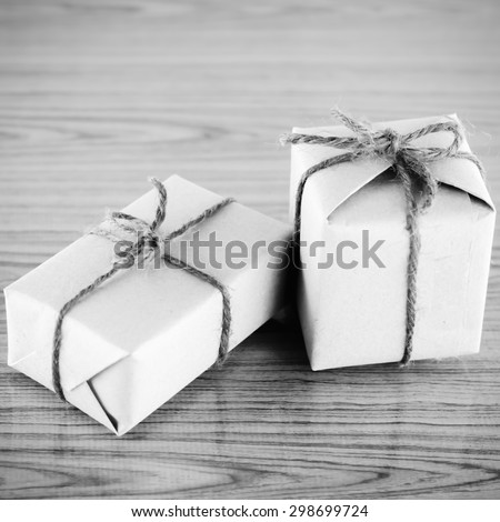 gift box on wooden background black and white color tone style