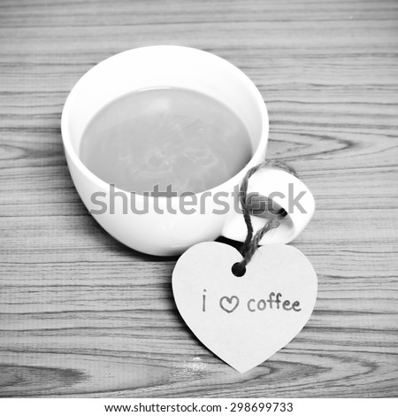 coffee cup with heart tag write I love coffee word on wood background black and white color tone style