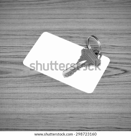 business card and keys on wood background black and white color tone style