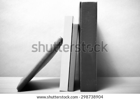 stand up of book on wood table background black and white color tone style